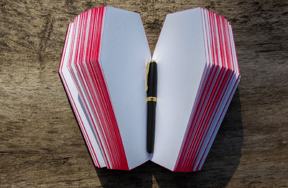 blank funeral book with pen kept in inside