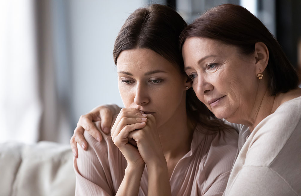 mature woman comforting, expressing empathy and support, helping to overcome problems, caring