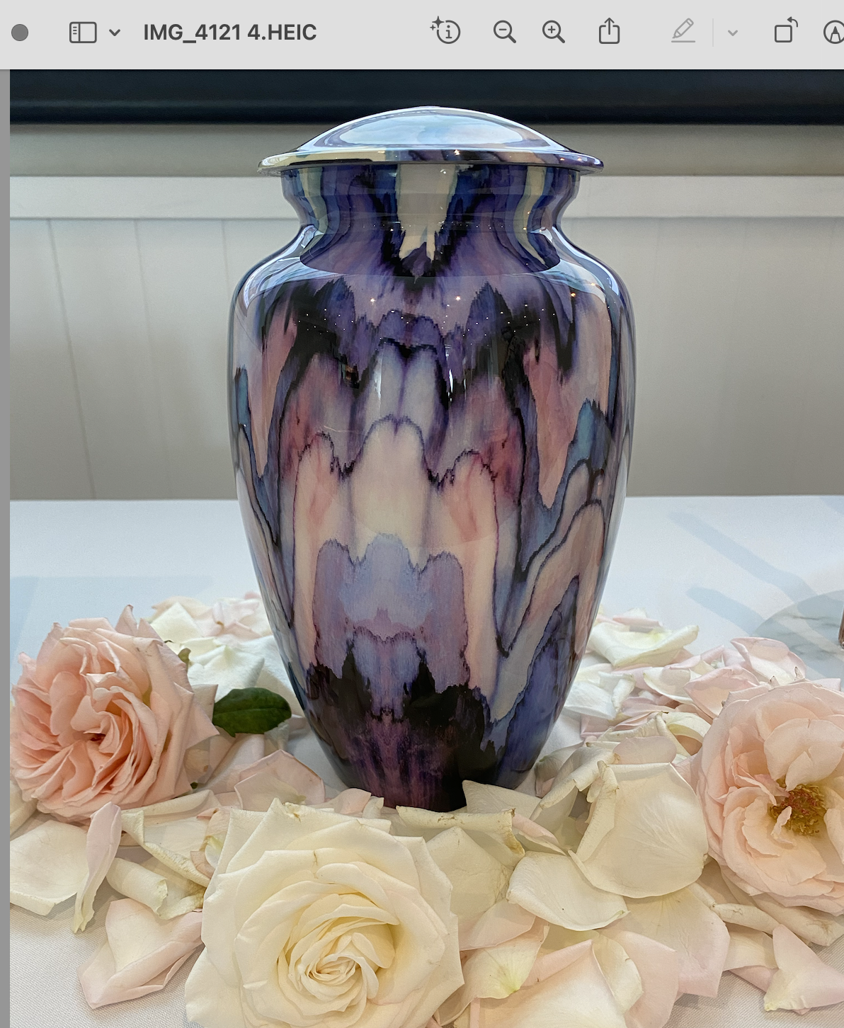 abstract colored urn surrounded by white flowers